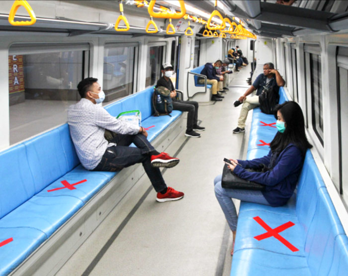 social distancing in light rapid transit train in Palembang